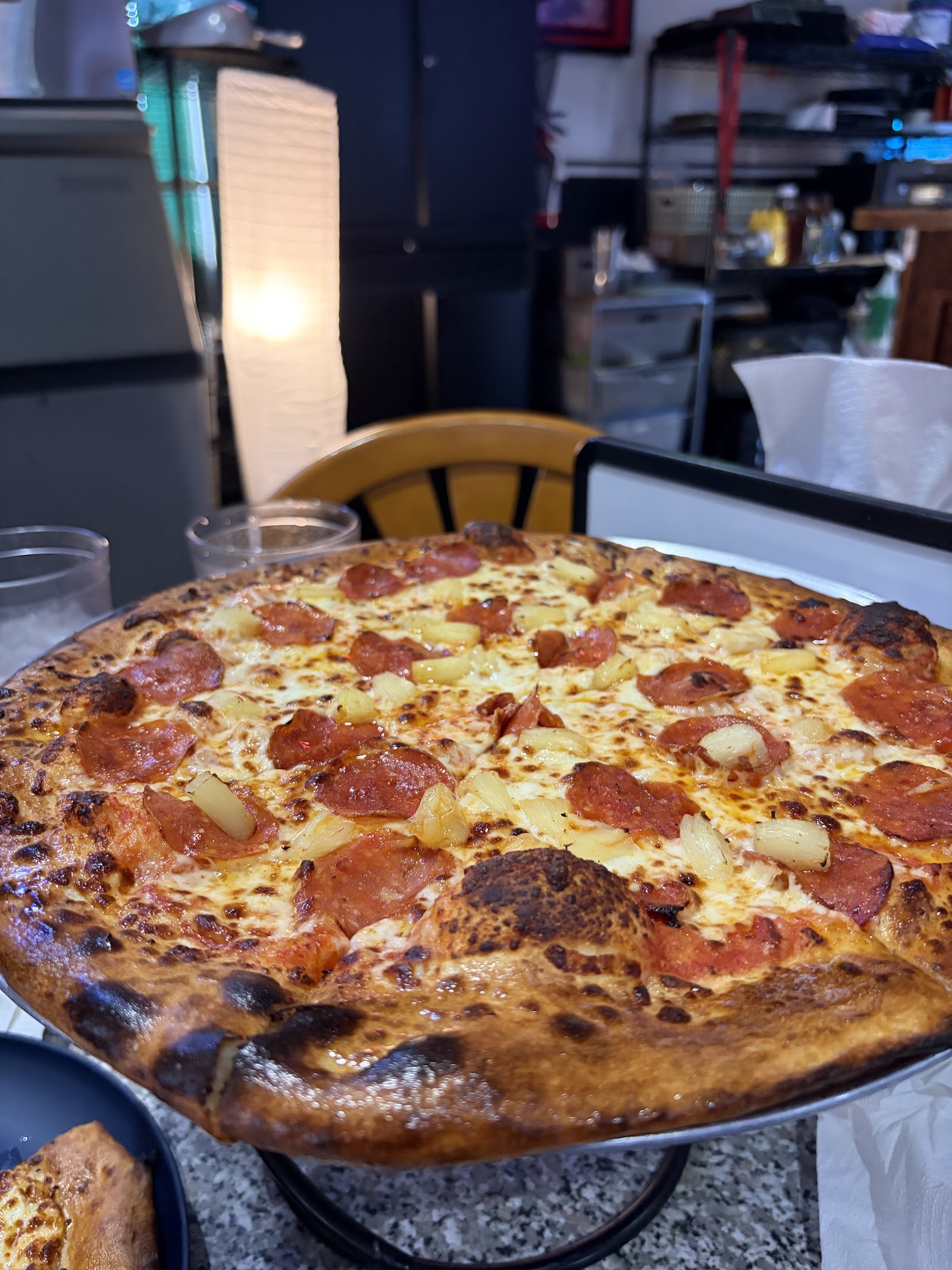 Hawaiian pizza with pepperoni and pineapple